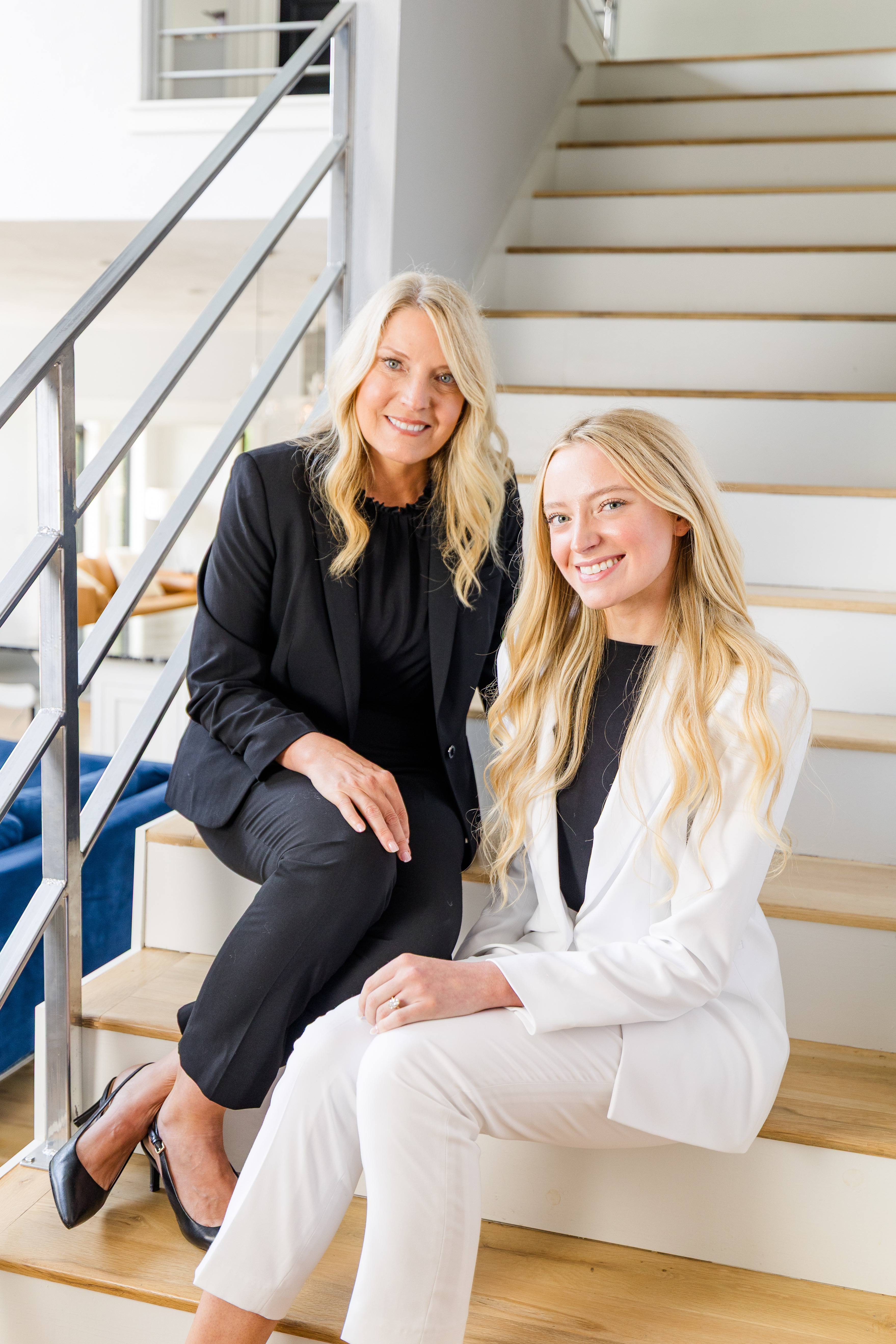 Ignite Performance co-founders Marcella and Reagan smiling together on a staircase